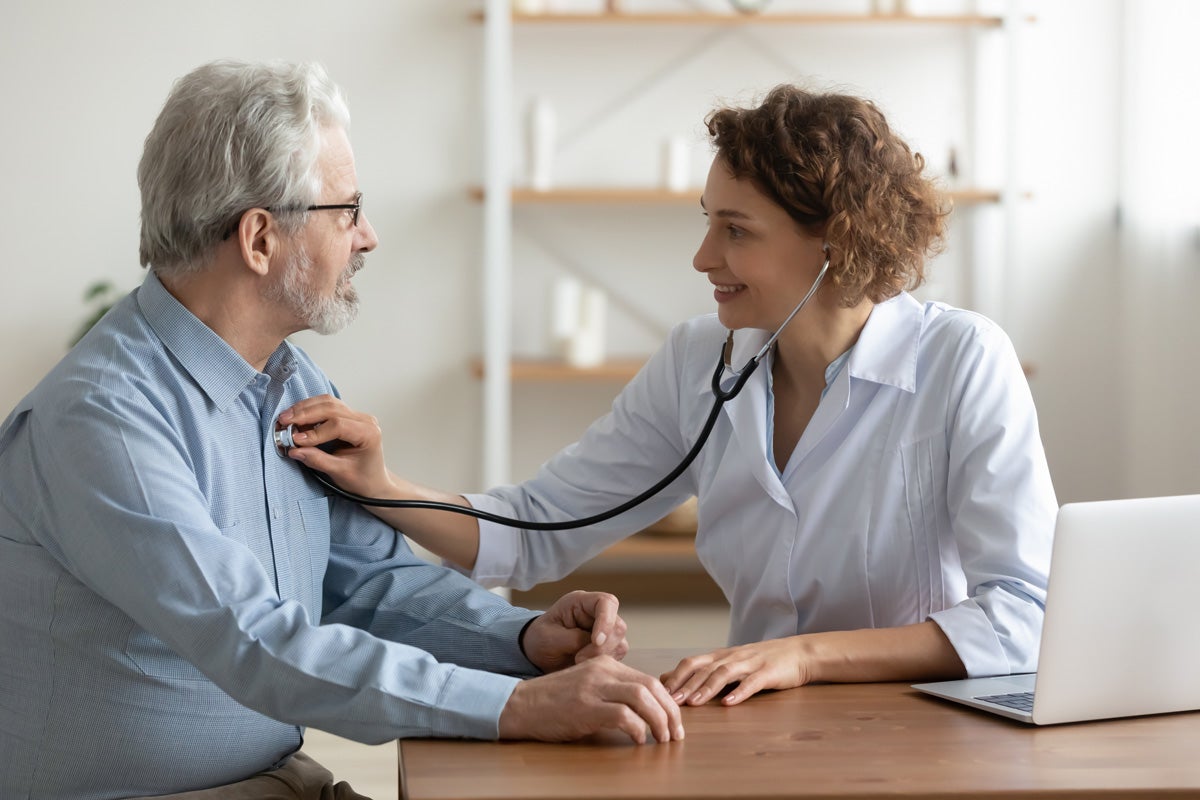 Doctor checking patient's heart rate