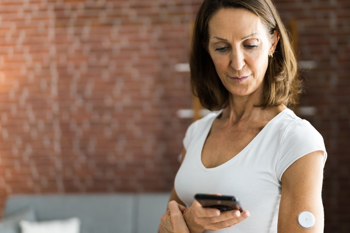 woman monitoring blood sugar