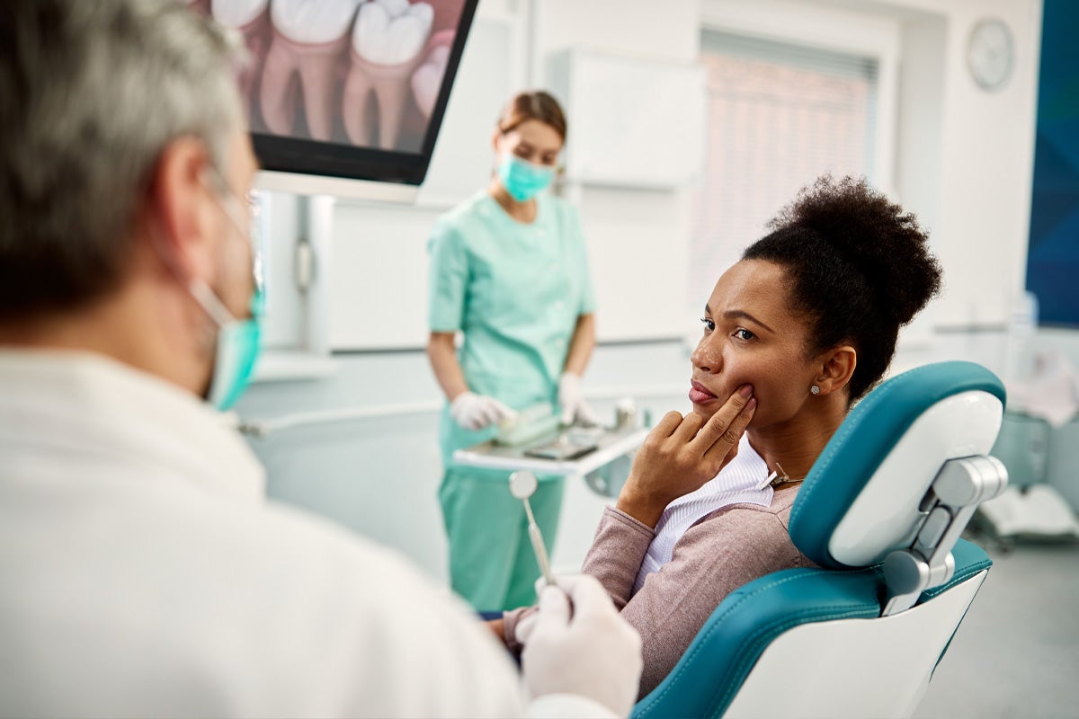 Woman with a cavity and toothache