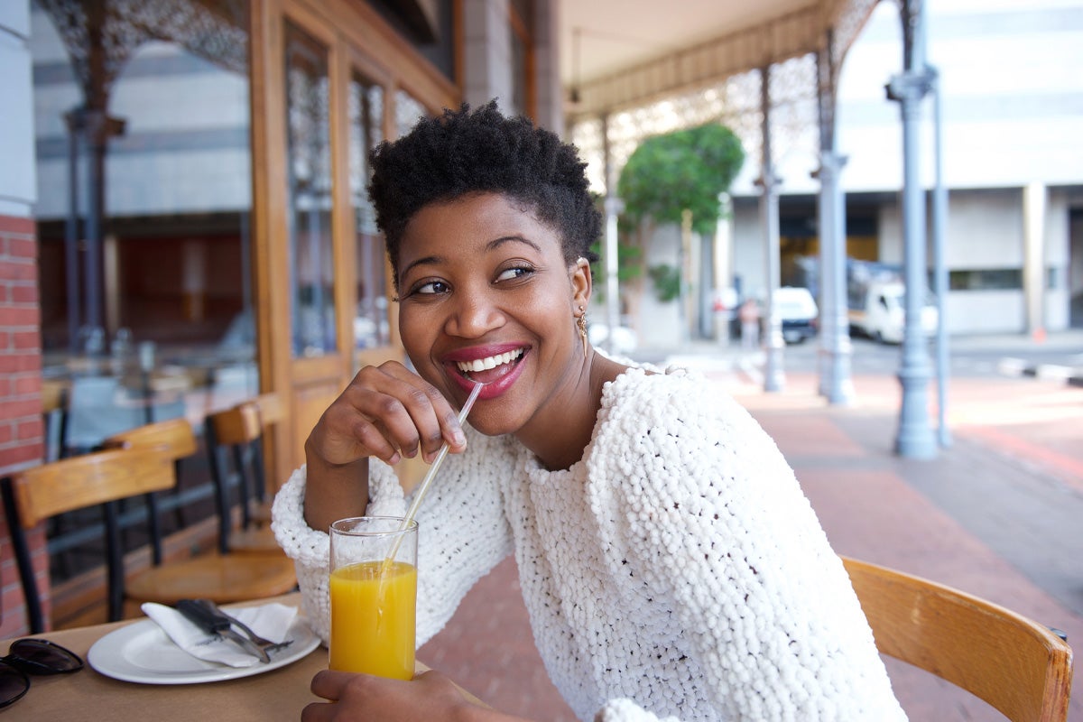 Woman drinking orange juice