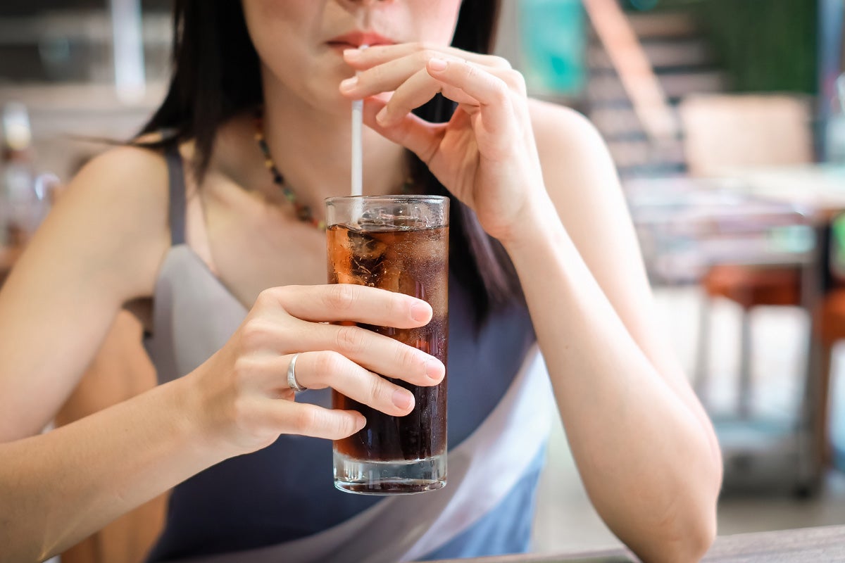 Woman drinking soda