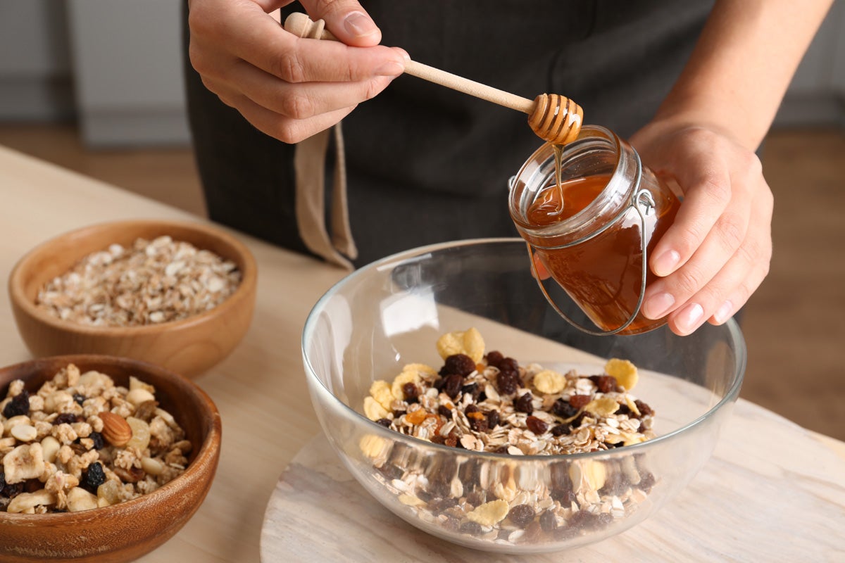 Adding Honey on Granola