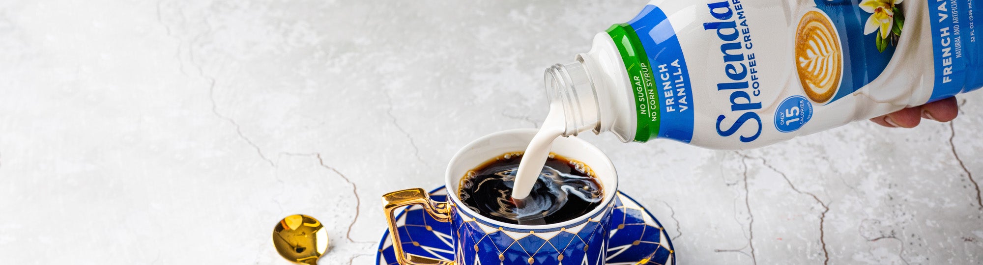 Pouring Splenda Coffee Creamer in Coffee